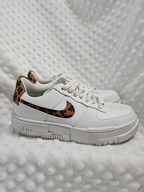 Nike White Low-Top Sneakers with Leopard Swoosh